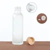 50ML 110ML 150ML Bottiglie di crema in vetro satinato Vasetti cosmetici rotondi Bottiglia per pompa per lozione per il viso con tappo con venature del legno