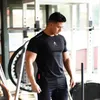 Verão camisa dos homens ginásios T vestuário Crossfit de Fitness Musculação Moda Masculina Curto New Designer Tee Tops Com Plus Size