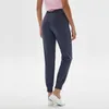 Yoga Outfits Женщины Активные лаунджные Потные штаны с карманами Высокий талию тренажерный зал Фитнес-бегуры свободные Тренировки работает спортивные брюки