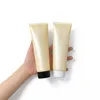 Bouteilles rechargeables de taille de voyage de bouteille de tube mou de compression vide givrée jaune pour la crème de main de lavage de visage de lotion de shampooing2129482565