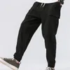 Wysokiej jakości męskie hip-hopowe bawełniane spodnie lniane ze sznurkiem w talii kieszeń luźne ołówkowe spodnie dorywczo haremowe spodnie dresowe