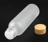 Frostat Glass Cream Flaskor Runda Kosmetiska Krukar Hand Face Lotion Pump Flaska Med Trä Grain Cap