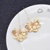 Boucles d'oreilles flores plaquées or pour femmes style simple style léger sculpté lotus goutte boucles d'oreilles pour femmes