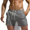 Cortometraggi da uomo Summer uomini fitness per bodybuilding uomo solido palestre di allenamento maschio a maglia traspirante per nuoto sport jogger spiaggia pantaloni corti