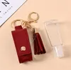 TASSEL LEATHER SLEEVE FÖR HAND SANITIZER KEY HOLDER KEYCHAINS 30 ML Hand Sanitizer Bottle Hermes täcker ryggsäck Keychain Pendent8779308