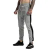 Casual Spodnie sportowe Mężczyźni Joggers Streetwear Hip Hop Spodnie dresowe Fitness Mężczyźni Sportswear Track Spodnie Stripe Gym Jogging Spodnie Mężczyźni
