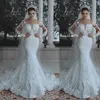 New Arabic Sexy Luxury Mermaid Wedding Dresses Lace Appliques Beaded Crystal Illusion Long Sleeves Overskirts Detachable Train Bridal Gowns
