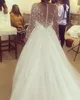 2020 Sheer Jewel Neck Abito da sposa Boho Maniche lunghe Cristalli di perline lucidi Abito da sposa Hippie Abiti da sposa mariage