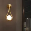 Nordisk personlighet kreativ vardagsrum metall vägglampa mode modern minimalistisk modell säng glas vägg lampa sovrum