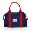 Nieuwe tas grote capaciteit mannen handbagage reizen duffle tassen nylon weekend tassen vrouwen multifunctioneel