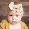 Solid color Bowknot headband Cute Baby knot hair bands Hood headwraps cuff Child fashion will and sandy gift