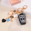 Good Luck Clover keychains Fashion Brands Key Chain Flower Keyrings Metal Key Ring Women Bag Charm Pendant Car Accessories