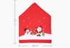 Enviar desde cubierta de la silla de EE.UU. 10Pcs 2020 Top Decoración de Navidad de Santa Claus Cocina Silla Tabla Covers Casa Decoración Casa De Chaise