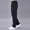 Pantalones negros sueltos para hombre talla grande 6XL pantalones casuales para hombre Primavera/otoño pantalones transpirables de secado rápido para hombre