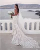Steven Khalil Boho Beach Sukienka ślubna 2021 Sexy Backless Mermaid Bride Dresses V-Neck 3D Koronkowe aplikacje Pasek Trumpet Garden Suknie ślubne