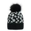 Fashion Femmes tricoter pom pom bonnet léopard crâne de crâne d'hiver chapeaux pompoms chauds décontractés