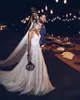 Lorie Boho bröllopsklänning 2019 Appliqued med blommor Tulle A-Line Sexig Backless Beach Bride Dress Bröllopsklänning