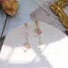 Japon et corée du sud nouvelle mode tempérament asymétrique fleurs long gland boucles d'oreilles réseau rouge fée cristal boucles d'oreilles en gros