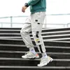 Diseñador de la marca Spring Hip Hop Joggers Hombres Pantalones Harem Negros Cintas multibolsillos Hombre Pantalones de chándal Streetwear Casual Mens Cargo Pants278V