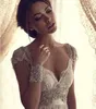 Moda maniche ad aletta che bordano pizzo una linea abiti da sposa lunghezza del pavimento per la sposa abiti da sposa con cerniera a terra