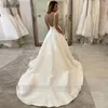 Abiti da sposa principessa con tasche A-Line profondo scollo a V senza schienale Abiti da sposa in pizzo Bottoni in tessuto satinato Boho 2020 Abiti da sposa Dubai