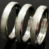 50 Uds. Anillo biselado de acero inoxidable con superficie de arena ancha de 4mm de plata para hombre y mujer, accesorio de joyería clásica de compromiso de boda, tamaños variados, CALIENTE