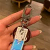 2020high Qualtiy Real Leather Keychain Keychain Key Chain Key Ring Holder Brand Chain Chain Clairs Designers Men Women Souvenirs Car Mots clés 6983219