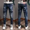 Man nödställda denimbyxor skador bleknade fem fickor Clement Fit Jeans Slim Leg Wash Effects Mens308U