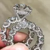 Bröllopsringar ankomst topp sälj lyxsmycken 925 sterling silver stor rund snitt vit topaz cz diamant par kvinnor tidvatten flödesdesign 65ess