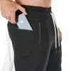 Corredores Sweatpants magro dos homens Calça Casual Sólidos Ginásios Cor treino algodão Sportswear Outono masculino da aptidão Crossfit Track Pants 201006