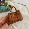 Mini Totes Handtas voor meisjes kinder portemonnee Designer sleutelhangers tassen hanger sleutelhanger Luxe tas Handtassen haak hoge kwaliteit dame schoudertassen airpods hoesjes oortelefoon HBP