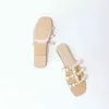 NXY Slippers 2022 nuevos zapatos de mujer al por mayor verano Pearl Beach zapatillas europeas y americanas transparentes de fondo plano sandalias abiertas 220125