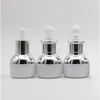 10pieces / parti 20ml Vitglas Essential Oil Dropperflaska med silver Aluminium Clourse Gummi 1oz Kosmetiska behållare