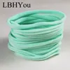 100 pcs Macio Stretch Fino Nylon Headbands Traceless Elastic Skinny Headband para DIY Acessórios Wear Hair LJ200908