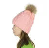 外国貿易ニット帽子、冬のファッションと暖かさ、女性の屋外の耳の保護シミュレーションウールのボールキャップ卸売
