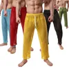 Pijamas masculinos ver através de pijama calças casuais lounge desgaste pijama hombre oco out sexy ropa interior hombre calça casa roupas 201125