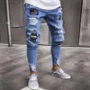 Pantalones rasgados ajustados elásticos de gama alta de estilo hip-hop para hombres de estilo europeo y americano nuevos jeans ajustados con insignia para hombres