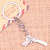 20pcs Fashion Keychain 45*20 mm gun browning pistol Pendants DIY Men Jewelry Car Key Chain Ring Holder Souvenir For Gift