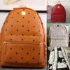Top quality classic fashion Korean version punk rivet School Bags travel male and female student backpack232u