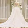 2021 Wspaniały arabski Dubaj Suknie ślubne A Line Illusion Długie Rękawy Aplikacje Koronki Top Kaplica Pociąg Satynowe Suknie Ślubne Vestidos de Novia