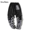 Una reta man broek mode streetwear stiksel kleur joggers hiphop lange broek mannen elastische taille vrachtpak mannen 201126