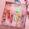 designer lip to lip oil Lips Balm Transparent Colorless Moisturizing and Hydrating Roll-on Fruit Flavour Makeup