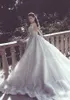Vestidos de novia de sirena de encaje de lujo con faldas de tren desmontables Ilusión de manga larga Vestidos de novia árabes de Dubai 2023 Vestidos de espalda abierta con apliques