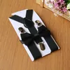 ボウタイネクタイセットの蝶ネクタイの服を持つ蝶ネクタイのファッション調節可能で伸縮性のあるキッズサスペンダー