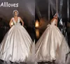 Vintage satinado Dubai árabe vestido de bola vestidos de novia Sexy cuello en V profundo apliques de encaje vestidos de novia con cuentas sin respaldo tren de la corte más tamaño Vestidos De Novia CL0080