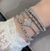 Bracciale punk di qualità di lusso con design cavo e diamante scintillante per regalo di gioielli da sposa da donna in platino placcato oro rosa 18 carati PS3981A