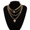Collana a catena multistrato gotica con perle barocche Collana girocollo con ciondolo a forma di cuore in oro punk per gioielli da donna