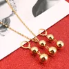 Collana di gioielli con ciondolo orecchini con perline di perle di colore oro moda calda per le donne