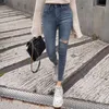 Plus size knopvlieg vrouwen jeans hoge taille denim broek vrouwen hoge elastische magere broek gescheurde gat rekbare vrouwen broek T200608