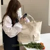 저녁 가방 한국어 대용량 캐주얼 캔버스 토트 여성을위한 2022 솔리드 멀티 포켓 어깨 간단한 디자이너 쇼핑 핸드백